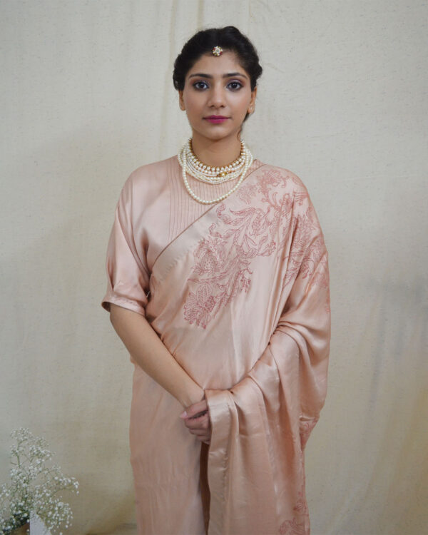 Embrace tradition with Ahmev’s modal silk peach colored saree