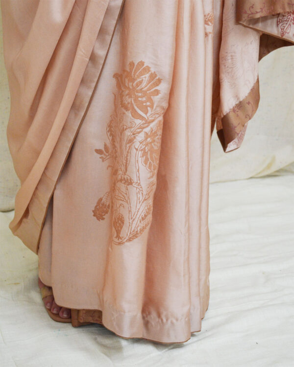 Embrace tradition with Ahmev’s modal silk peach colored saree